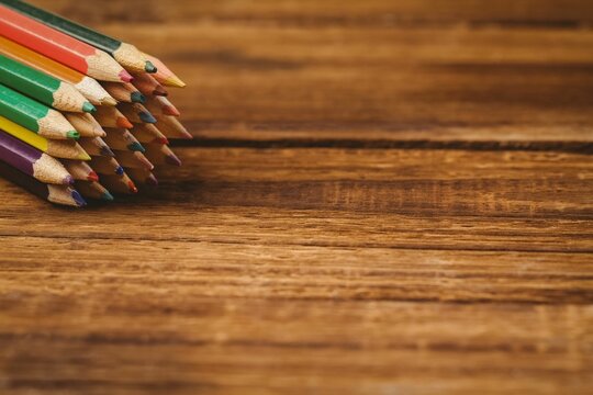 Color pencils on wooden table