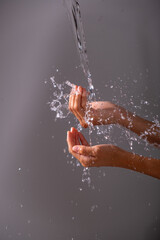 Fototapeta premium Close-Up of Water Droplets Dripping on Hands – Refreshing and Clean,Close-Up of Water Droplets Dripping on Hands – Refreshing and Clean8.jpg, Close-Up of Water Droplets Dripping on Hands – Refreshing 