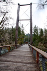 Side view from along a wooden suspension bridge for pedestrians. Taken while hiking along the...