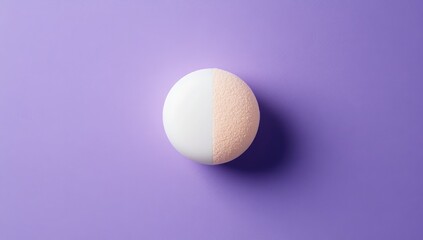 Half-white, half-peach-colored round object on a vibrant purple background