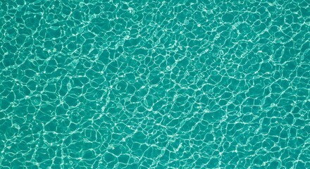 Aqua Texture: Shimmering turquoise water surface with ripples and reflections, creating a calming and abstract background texture.