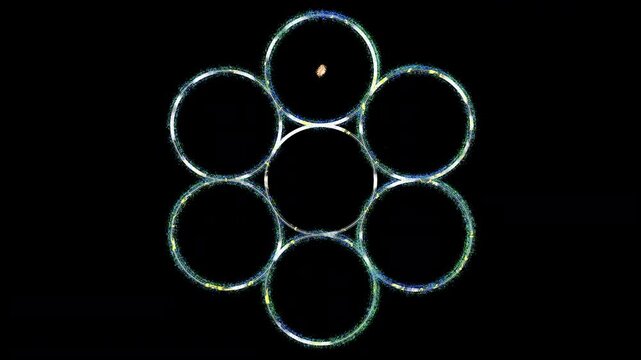 Abstract sacred-geometry animation. Seven shimmering circles appear, morph and interconnect to reveal Metatron&rsquo;s Cube on a black background. Composite over footage, VJ loops, stage LED walls.