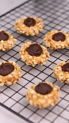 Cheese Peanut Chocolate in the photo on a marble table and small wooden bowl and mesh pan