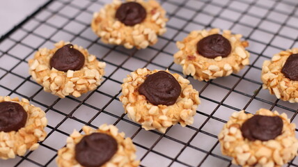Cheese Peanut Chocolate in the photo on a marble table and small wooden bowl and mesh pan