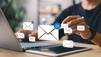 Person checking email icons floating above. Concept of digital communication, mobile inbox,...