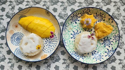 Delicious mango sticky rice in a beautifully decorated tray
