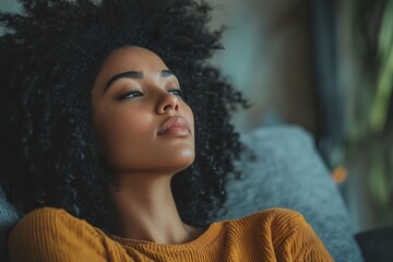 Stressed woman feeling depressed and lonely, sitting on the sofa in her home, struggling with emotional challenges., Generative AI