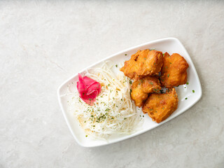 Fried chicken and cabbage salad on a plate