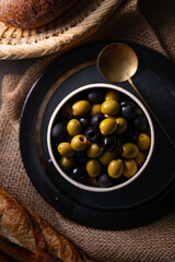 Green and Black Olives.This close-up features vibrant green and rich black olives, perfect for...