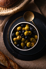 Green and Black Olives.This close-up features vibrant green and rich black olives, perfect for...