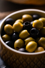 Green and Black Olives.This close-up features vibrant green and rich black olives, perfect for...