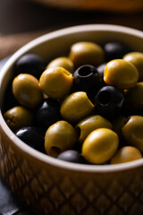 Green and Black Olives.This close-up features vibrant green and rich black olives, perfect for...