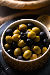 Green and Black Olives.This close-up features vibrant green and rich black olives, perfect for...