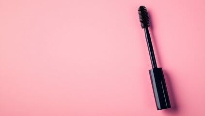 Obraz premium Black mascara wand on pink background (1)