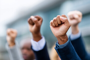 Obraz premium group of unrecognizable people raising their fists in success