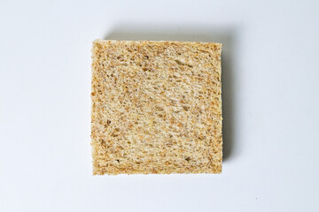 Top view of one whole wheat sliced bread with abstract product background. Isolated on white. Clipping path. High angle, above.