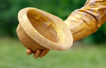 A person is holding a hat in their hand