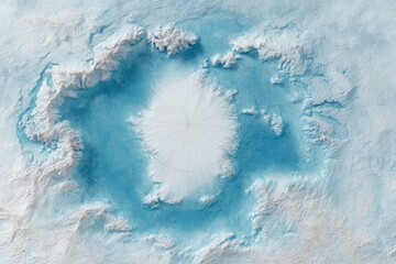 An aerial view of a polar landscape predominantly white and blue suggesting ice snow and water