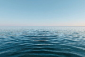 Obraz premium Calm sea under a pale blue sky gentle waves