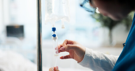 Nurse, hands and IV drip in hospital for medication, illness treatment or patient nutrients....