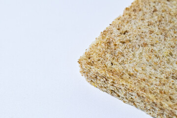 Close up view of half whole wheat sliced bread with abstract product background. Isolated on white. Clipping path