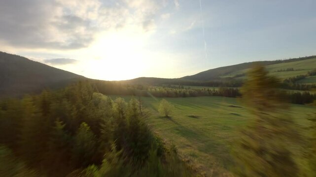 FPV drone gliding through the treeline of Slovakia&rsquo;s mountain landscape