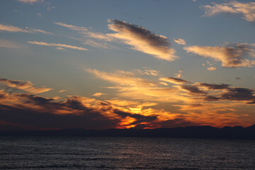 A scenic view of a sunrise or sunset, with warm tones painting the sky. Perfect for use as...