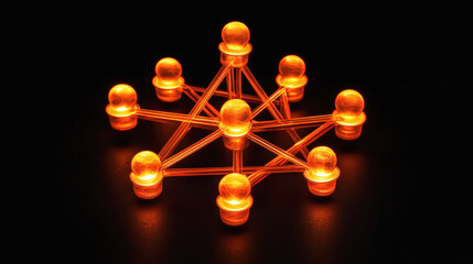 A glowing orange network of interconnected nodes forming a geometric molecular or technological structure on a dark background.