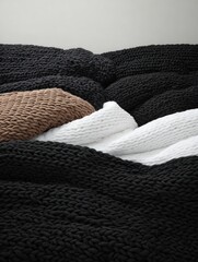Knitted bedding set in black, brown, and white