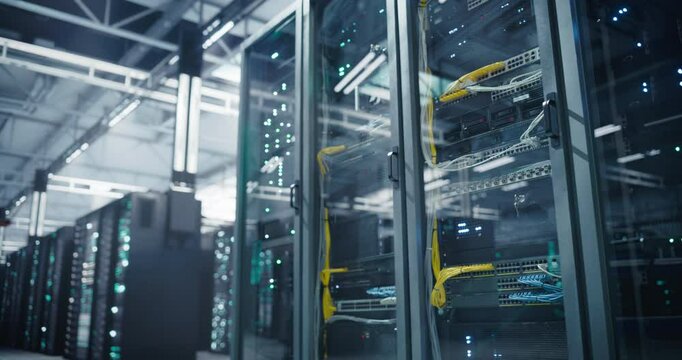 Establishing Shot with Advanced AI Data Center with Server Racks in a Modern Facility. Female IT Technician Walking with a Laptop in the Corridor. Specialist on Her Way to Do Hardware Maintenance