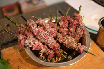Grilled Meat Skewers on Bay Laurel Sticks – Rustic BBQ Dish with Herbal Flavor
