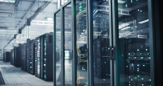 Advanced Data Center with Server Racks in a Modern Facility. Information Technology Business for Commercial Big Data Processing and Saas Compute. Establishing Static Footage - Powered by Adobe