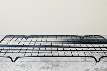 Side view of empty black baking rack. copy space, empty space, free space for food photo. close up,...
