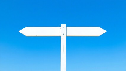 Blank white wooden signpost with two arrows pointing at opposite directions against fresh blue sky