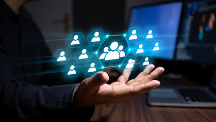 Person holding network of digital human icons, concept for HR, teamwork, and networking.