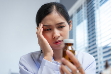A confident Asian female veterinarian at her animal clinic feels stressed and overwhelmed by office...