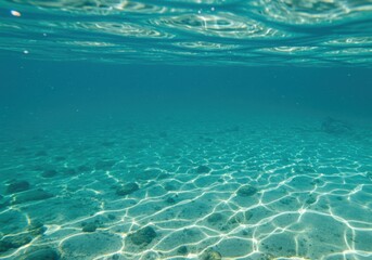 Underwater scene with sunbeams on sandy seabed