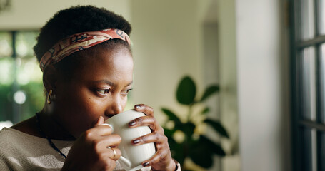 Thinking, drink tea and black woman in home for relax, peace or calm with serious mindset on...