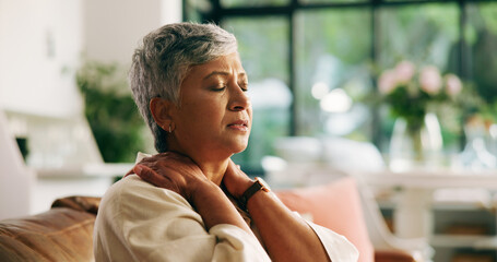 Neck pain, tension and senior woman on sofa in home with discomfort, tired and stiff muscle....