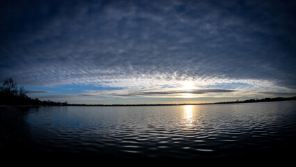 panoramic sunset over the lake in early winter