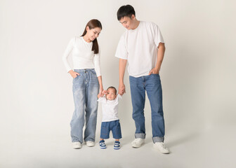 Family Poses Together in a Studio Portrait With Joyful Smiles and Playful Atmosphere