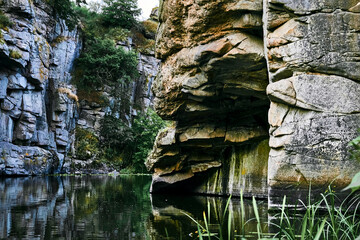Rocky deep stone canyon with smoothly flowing water