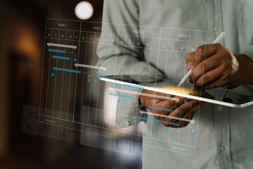 Project management software person using tablet with digital project timeline overlay, showing planning and scheduling, professional setting