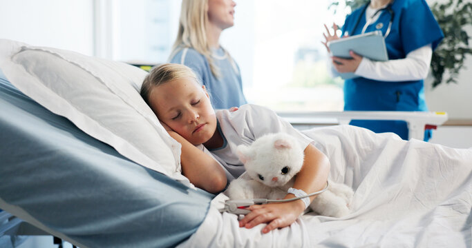 Healthcare, child patient and sleeping in hospital bed for pediatric recovery, illness and healing. People, doctor and speaking to mother at clinic for kid health update, medication fatigue and rest
