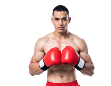 A muscular male boxer stands confidently wearing red boxing gloves and red shorts, ready for a match.