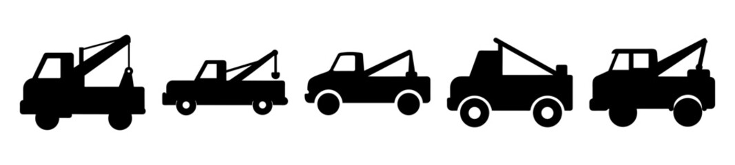 Collection of cartoon tow truck silhouettes with a white background and solid fill