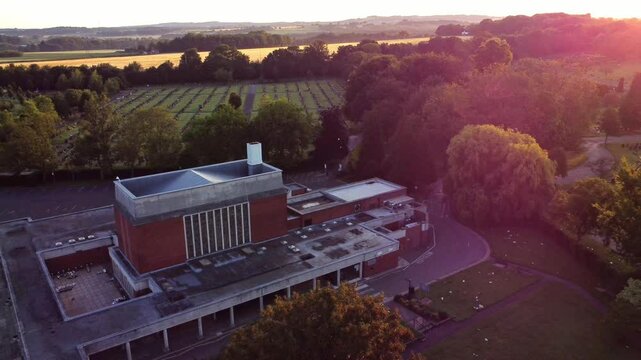 St Helens crematorium aerial view over cemetery gardens and farmland during golden hour sunrise