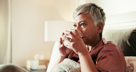 Bed, drinking water and mature woman in home for wellness, hydration and morning routine....