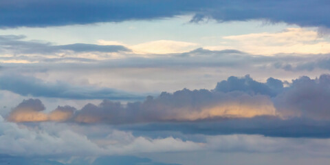  Serene layered clouds at sunset with soft pastel hues in a tranquil sky landscape