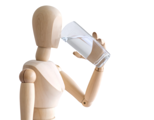 Wooden mannequin drinking water from a clear glass on a white background.